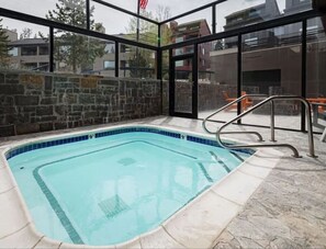 The large shared outdoor hot tub is less than 50 yards from your condo!