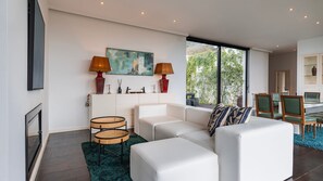 Secondary lounge area adjacent to the dining table. #modern #stylish
