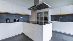 Elevate your culinary adventures in our fully equipped kitchen; a chef's dream come true. This space is designed to inspire and delight your inner gourmet. #kitchen #lovelystay