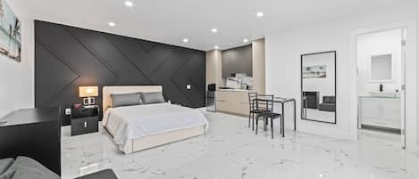 Spacious room (400 sq ft) with Queen-sized bed and convertible sofa bed.