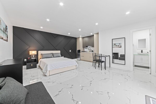 Spacious room (400 sq ft) with Queen-sized bed and convertible sofa bed.
