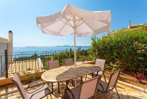 Outdooring dining area with sea views