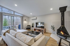 Comfortable couch to binge watch your favorite shows while enjoying the fire