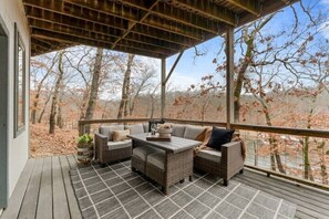 Downstairs deck with couch and table