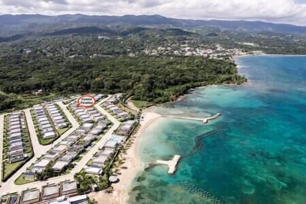 Sky view of the gated community with private beach and pool.