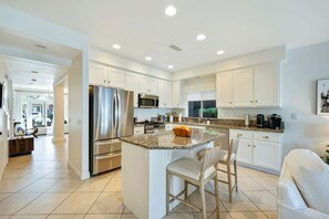 Fully stocked kitchen with supplies.