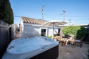 Hot tub and outdoor seating for four.