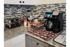 Coffee and tea provided. Keurig, French press, and full pot of coffee options. 