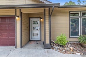 Modern glass front entry door, looking from semi-private patio.