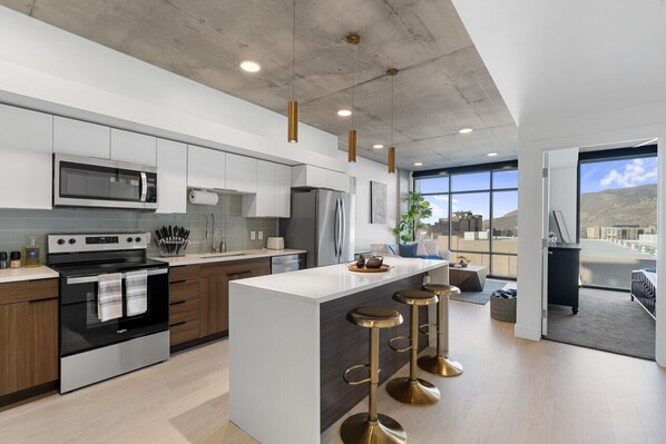 View of kitchen and cozy living room.