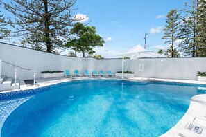 Newly renovated heated swimming pool within the building