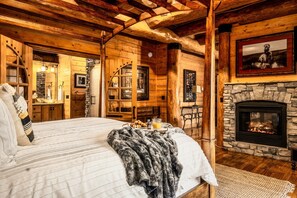 Primary suite with double-sided fireplace and living area