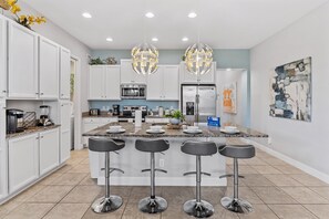 Sleek Kitchen of the Townhouse in Davenport Florida - Efficient open concept kitchen  - Fully equipped  - Breakfast Bar and high chairs - Well-lit workspace with strategically placed task lighting