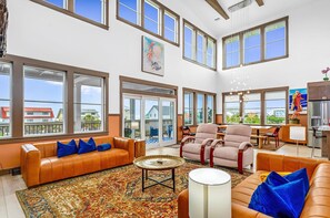Open, airy, bright living area looking over the ocean