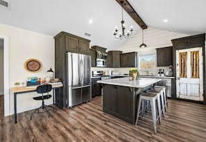 Spacious and inviting, this kitchen features an island perfect for meal prep or casual dining. It's a great gathering spot for family and friends.