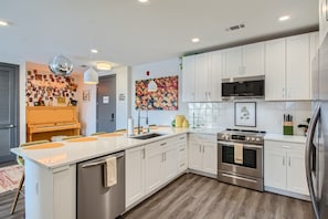 Modern cooking appliances and spacious countertops, the kitchen has it all!