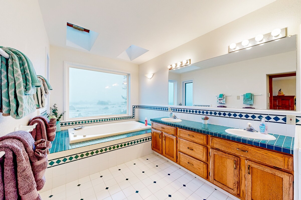 Lovely oceanfront oasis with panoramic views, patio, & games – near beach & golf