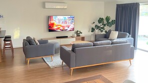 Large open family area with TV and soundbar