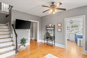 Living Room into foyer, kitchen and upstairs