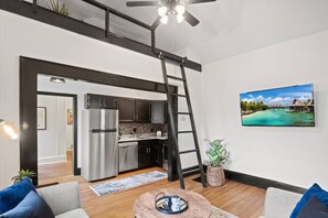 Ladder leads to loft area which is a nice nook for reading or working a puzzle if you have time.