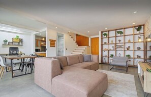 Spacious lounge with dining table and work-from-home desk