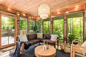 Escape to our enclosed porch on rainy days, cozy up and drink coffee
