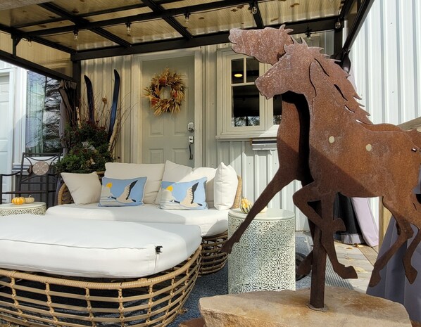 Cuddle couch on the covered deck.