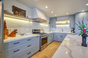 Kitchen with fully stocked appliances
Top-of-the-line cookware.