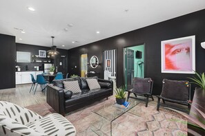 Comfortable living room with lots of natural light and a Smart TV with all the streaming apps.