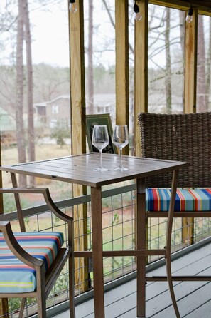 Serenity at its finest: Embracing the tranquil beauty of lakeside living from the comfort of our charming porch