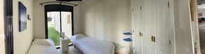 Bedroom 2, twin beds, built in wardrobe. Panoramic view.