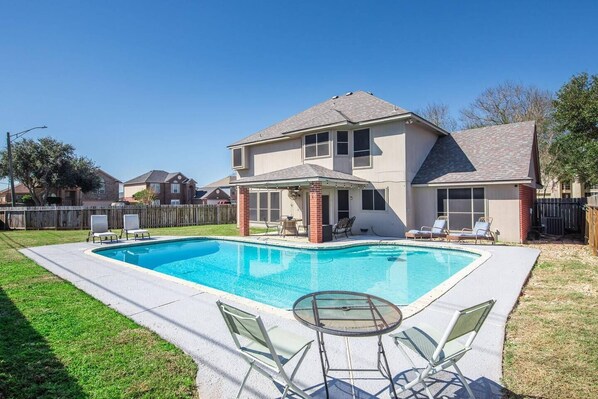 Your personal oasis: enjoy sun-soaked days by this gorgeous pool.