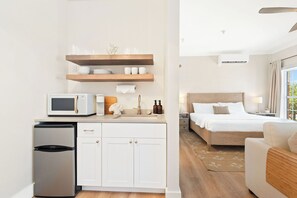 Kitchenette in condo features a toaster, Keurig/Drip coffee maker, mini fridge/freezer, and dishes!