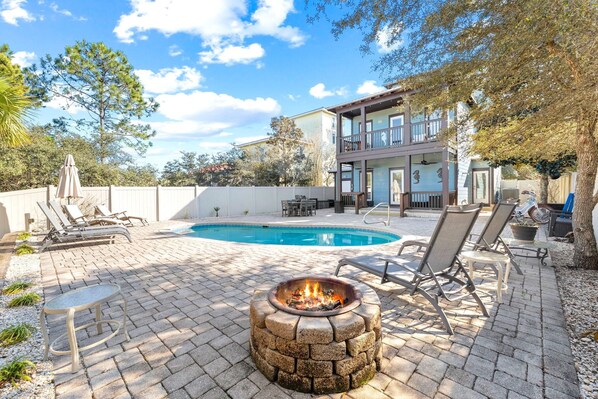 Backyard features a wood burning fire pit!