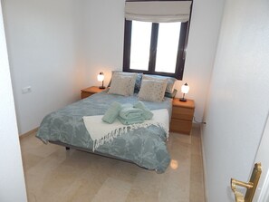 Double bedroom with a/c and ceiling fan 