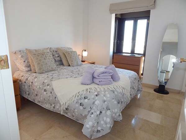 Master bedroom with A/C, ceiling fan and fitted wardrobes