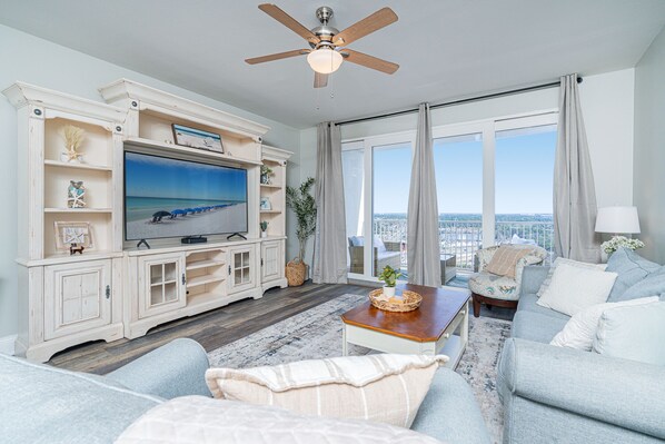 Coastal comfort awaits in the living room, with Smart TV & stunning views