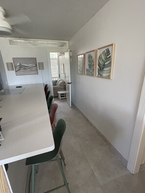 Kitchen counter seating, door to the office