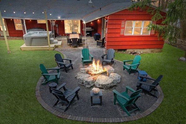 The ultimate getaway! Relax around the fire with eight comfortable ADK chairs.