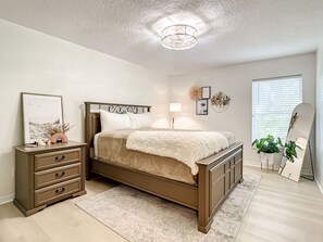 Queen bed with dresser for storage. Full size mirror.