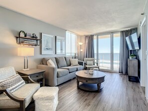 A cozy and stylish living room with ocean views and a welcoming atmosphere.