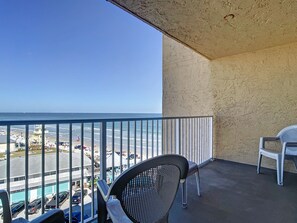 Tranquil balcony with stunning ocean views and comfortable seating.