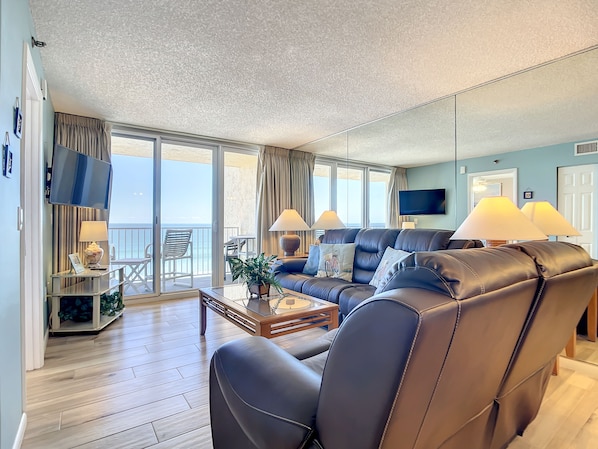 Living room overlooking the balcony. Mounted TV.