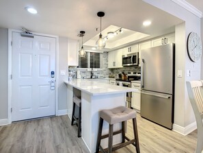 Open-concept kitchen with sleek appliances and a spacious dining area for family meals.