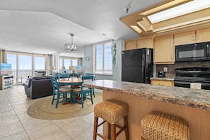 Spacious kitchen and dining area perfect for family meals with ocean views.