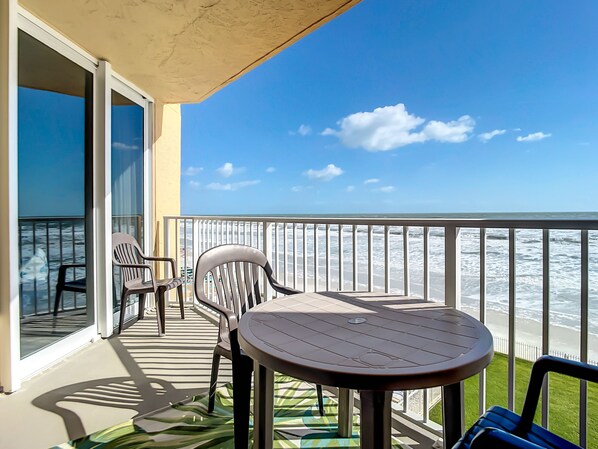 Relax on the private balcony with seating for two, offering uninterrupted views of the ocean and perfect for enjoying morning coffee or evening sunsets.