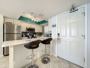 Start your day right! A breakfast bar at the entrance of the condo provides a convenient spot to enjoy your morning coffee.