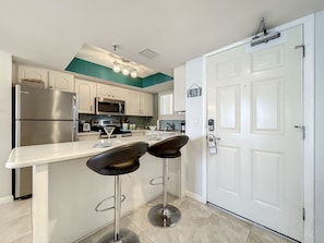 Start your day right! A breakfast bar at the entrance of the condo provides a convenient spot to enjoy your morning coffee.