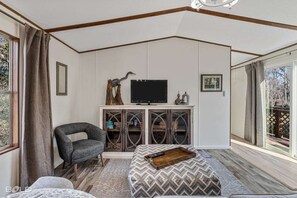 Cozy living room with large glass doors for viewing the lake right from your couch.
