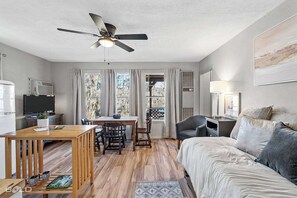 Super cute cottage with retro fridge & antique dining table.